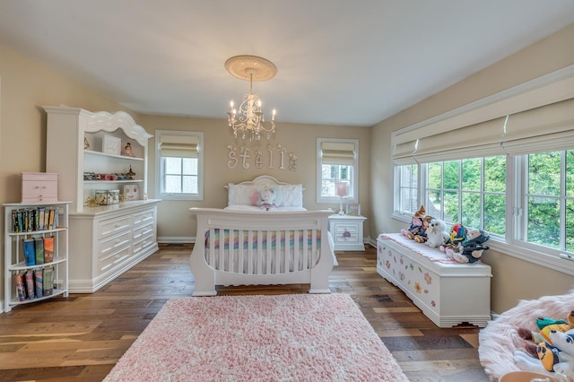 2105 Lillian Ln, Lisle, IL 60532 - bedroom featuring a chandelier, wood finished floors, and baseboards