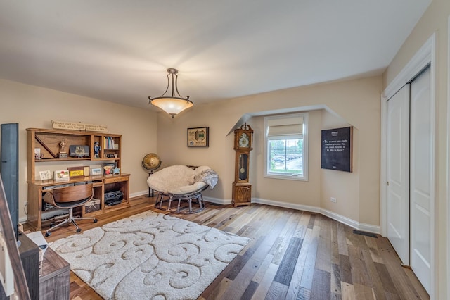 2105 Lillian Ln, Lisle, IL 60532 - sitting room with wood finished floors, baseboards, a desk, and arched walkways