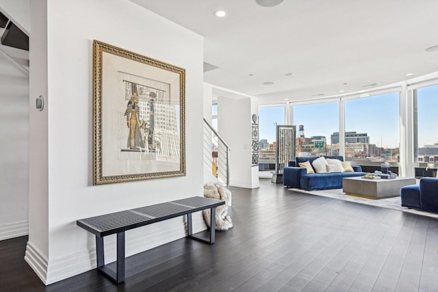 600 N Kingsbury Ave Unit 506, Chicago, IL 60610 - living area featuring wood finished floors, a city view, stairs, healthy amount of natural light, and recessed lighting