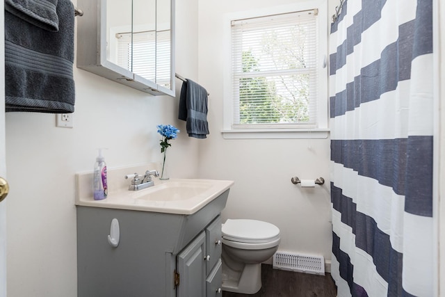 711 Parkside Dr, Rockford, IL 61108 - full bath with toilet, vanity, wood finished floors, and a shower with curtain