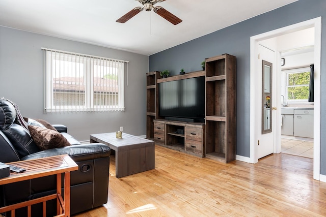 711 Parkside Dr, Rockford, IL 61108 - living room featuring a ceiling fan and light wood-style flooring