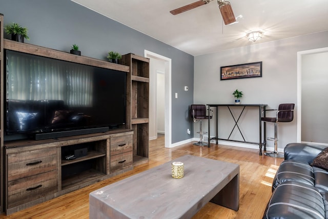 711 Parkside Dr, Rockford, IL 61108 - living room featuring ceiling fan, wood finished floors, and baseboards