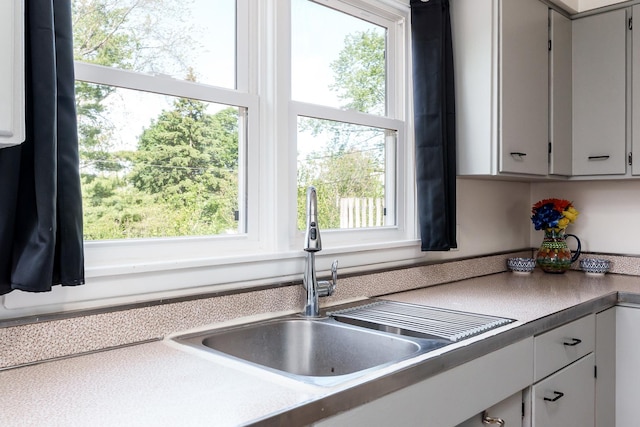 711 Parkside Dr, Rockford, IL 61108 - kitchen with a sink, healthy amount of natural light, and light countertops