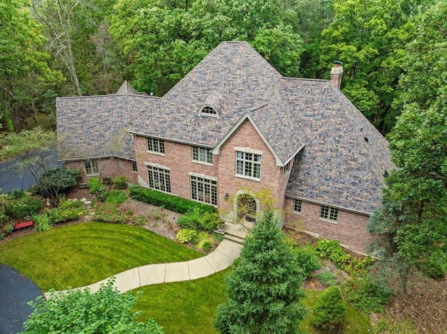 38W250 Burr Road Ln, Saint Charles, IL 60175 - tudor home with a high end roof, a chimney, a front yard, and brick siding