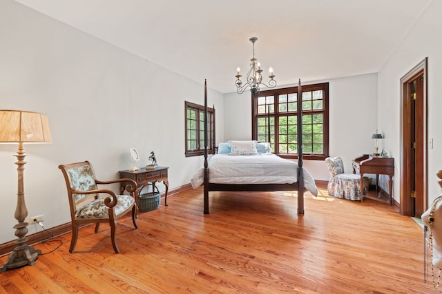 38W250 Burr Road Ln, Saint Charles, IL 60175 - bedroom featuring light wood-style floors, a chandelier, and baseboards