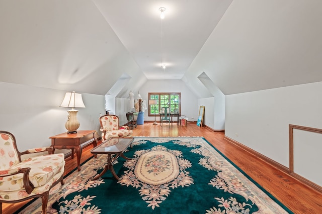 38W250 Burr Road Ln, Saint Charles, IL 60175 - living area featuring wood finished floors, vaulted ceiling, and baseboards