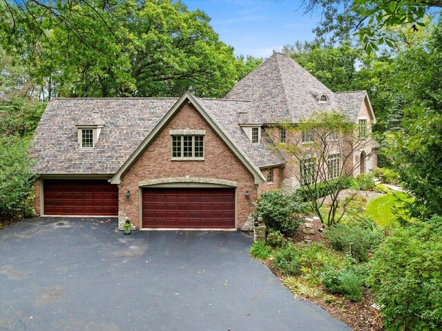 38W250 Burr Road Ln, Saint Charles, IL 60175 - view of front of home with asphalt driveway, a garage, and brick siding