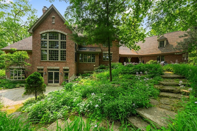38W250 Burr Road Ln, Saint Charles, IL 60175 - rear view of property featuring a patio, brick siding, a chimney, and french doors