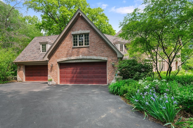 38W250 Burr Road Ln, Saint Charles, IL 60175 - view of front facade with a garage, brick siding, and asphalt driveway