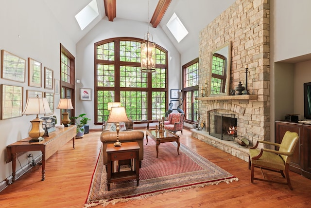38W250 Burr Road Ln, Saint Charles, IL 60175 - living area with a skylight, high vaulted ceiling, beam ceiling, wood finished floors, and a chandelier