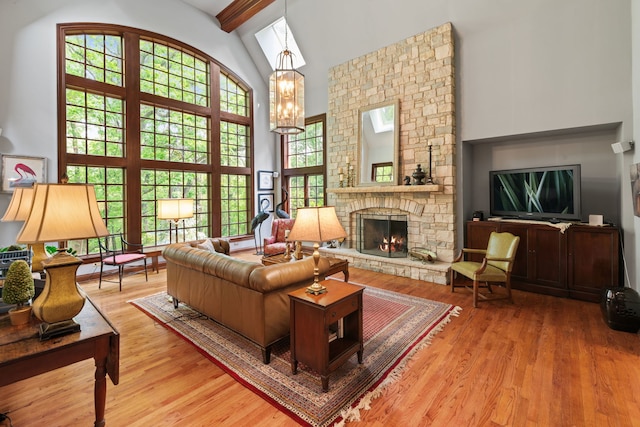 38W250 Burr Road Ln, Saint Charles, IL 60175 - living room with high vaulted ceiling, a fireplace, wood finished floors, beamed ceiling, and a chandelier