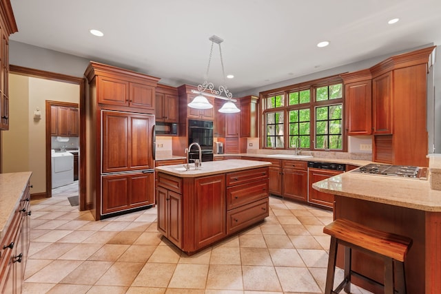 38W250 Burr Road Ln, Saint Charles, IL 60175 - kitchen with black appliances, a sink, washer and dryer, recessed lighting, and hanging light fixtures