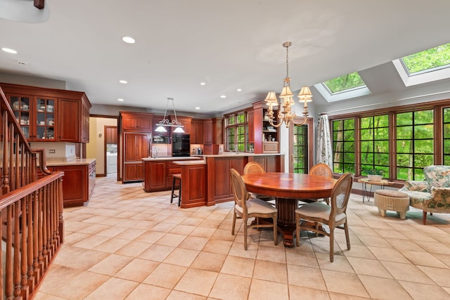 38W250 Burr Road Ln, Saint Charles, IL 60175 - dining space with a chandelier, a skylight, plenty of natural light, recessed lighting, and light tile patterned flooring