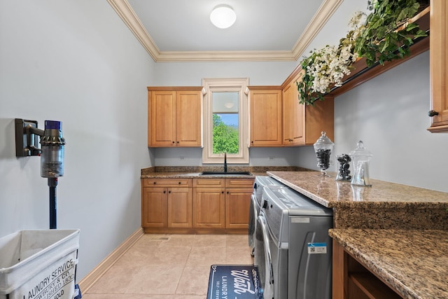 115 Carmela Ct, Bloomingdale, IL 60108 - kitchen with a sink, washer and clothes dryer, crown molding, dark stone countertops, and baseboards