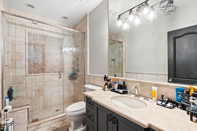 115 Carmela Ct, Bloomingdale, IL 60108 - bathroom with toilet, vanity, a shower stall, and tile walls