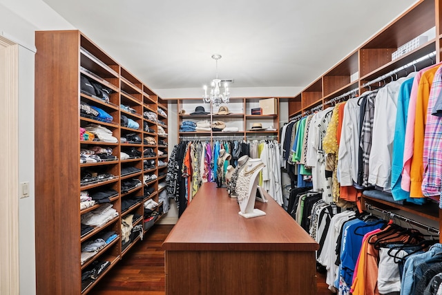 115 Carmela Ct, Bloomingdale, IL 60108 - walk in closet with a chandelier and dark wood-style floors