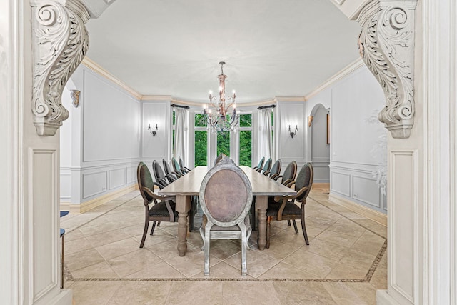 115 Carmela Ct, Bloomingdale, IL 60108 - dining room with a decorative wall, a chandelier, arched walkways, crown molding, and inlaid floor details