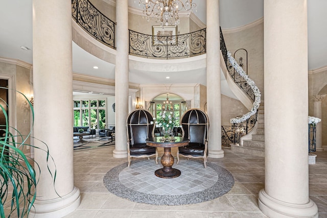 115 Carmela Ct, Bloomingdale, IL 60108 - foyer entrance featuring a chandelier, decorative columns, crown molding, healthy amount of natural light, and a high ceiling