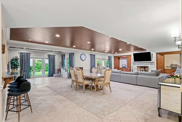 115 Carmela Ct, Bloomingdale, IL 60108 - dining room with crown molding, recessed lighting, healthy amount of natural light, and a stone fireplace