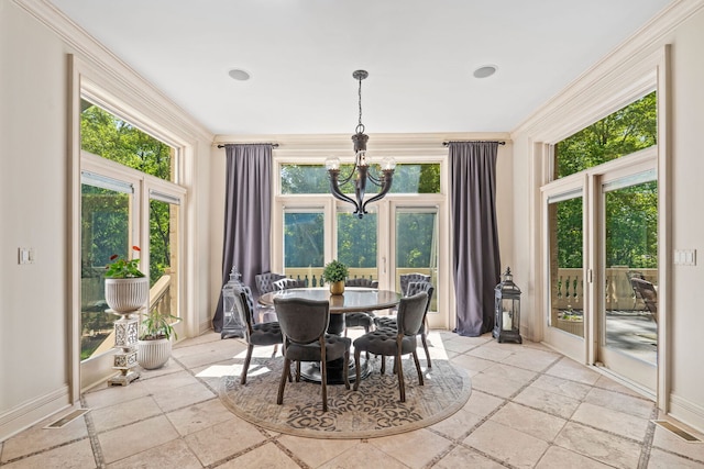 115 Carmela Ct, Bloomingdale, IL 60108 - dining room featuring a chandelier, stone tile floors, ornamental molding, and baseboards
