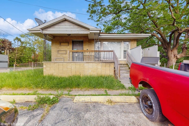 14301 S Halsted St, Riverdale, IL 60827 - view of front of property featuring brick siding, covered porch, and stairs
