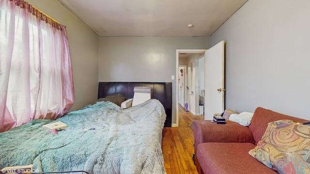 14301 S Halsted St, Riverdale, IL 60827 - bedroom featuring wood finished floors