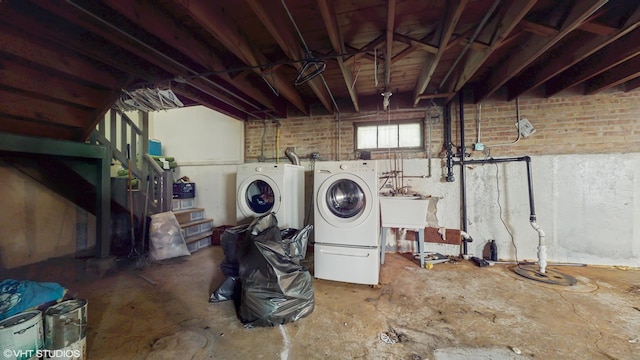 14301 S Halsted St, Riverdale, IL 60827 - laundry room with washing machine and dryer and brick wall