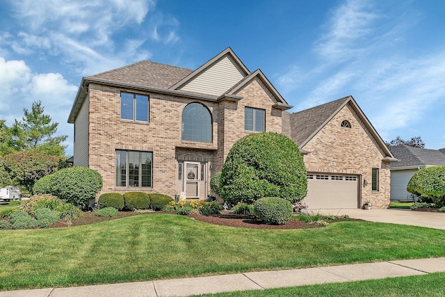 507 Cambridge Ln, Shorewood, IL 60404 - traditional-style house with brick siding, driveway, a front yard, and a garage