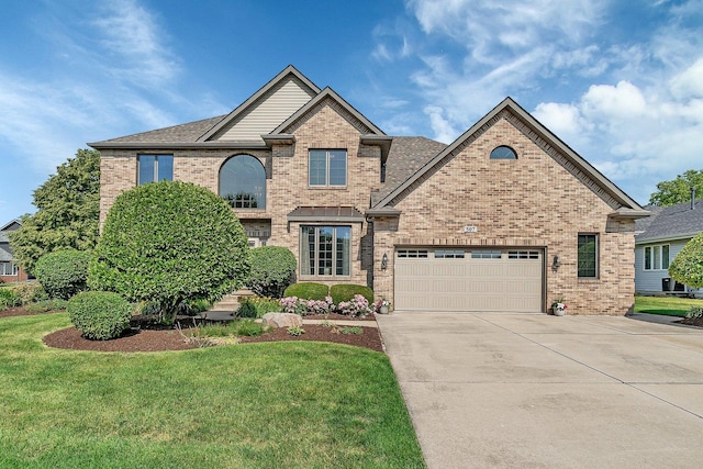 507 Cambridge Ln, Shorewood, IL 60404 - view of front of property with brick siding, concrete driveway, an attached garage, and a front yard
