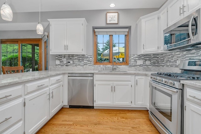 507 Cambridge Ln, Shorewood, IL 60404 - kitchen with stainless steel appliances, recessed lighting, white cabinetry, tasteful backsplash, and healthy amount of natural light