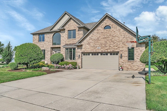 507 Cambridge Ln, Shorewood, IL 60404 - view of front facade featuring brick siding, concrete driveway, and a garage