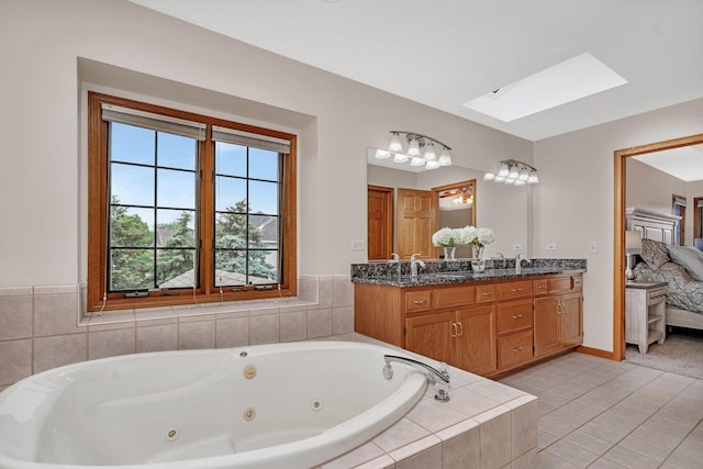 507 Cambridge Ln, Shorewood, IL 60404 - ensuite bathroom with a skylight, double vanity, a jetted tub, and tile patterned floors