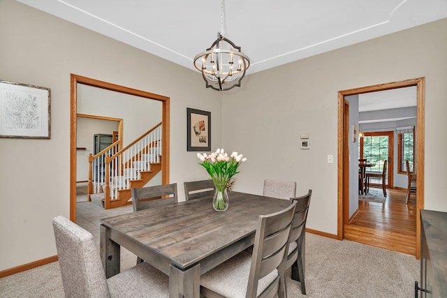 507 Cambridge Ln, Shorewood, IL 60404 - dining room with a chandelier, light carpet, and stairway