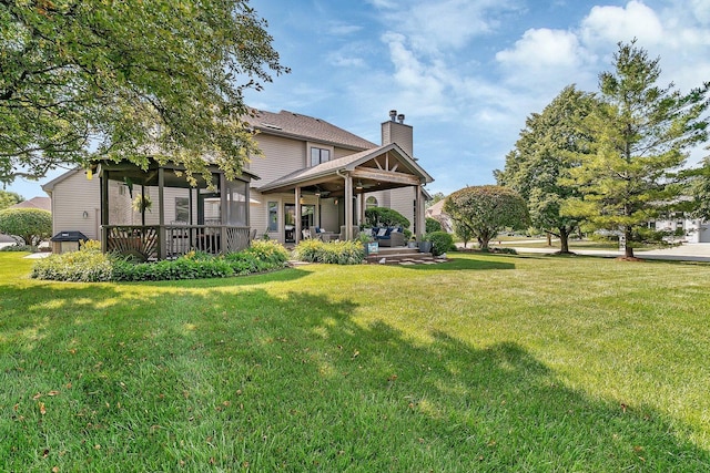 507 Cambridge Ln, Shorewood, IL 60404 - back of property with a chimney, a yard, ceiling fan, outdoor lounge area, and a deck