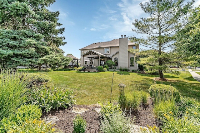 507 Cambridge Ln, Shorewood, IL 60404 - back of property featuring a lawn, a chimney, and a gazebo