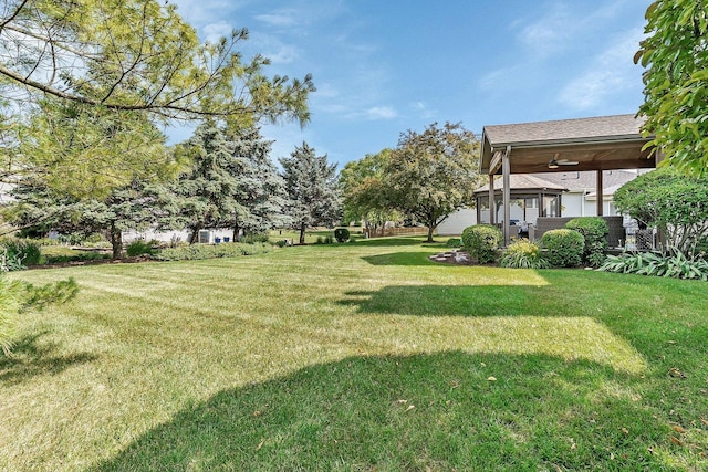 507 Cambridge Ln, Shorewood, IL 60404 - view of green lawn featuring a ceiling fan