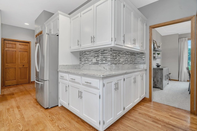 507 Cambridge Ln, Shorewood, IL 60404 - kitchen with freestanding refrigerator, white cabinets, tasteful backsplash, light wood finished floors, and recessed lighting