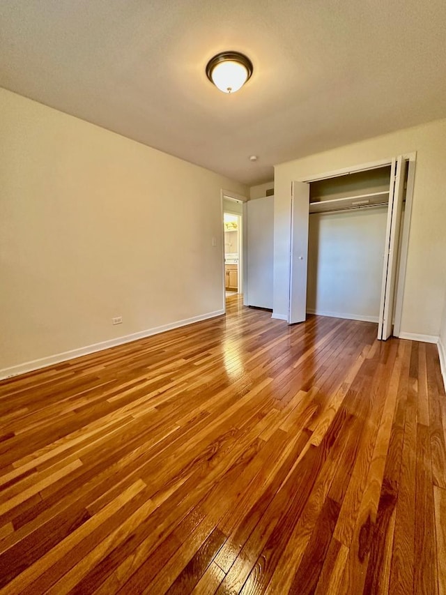 319 Triggs Ave, Elgin, IL 60123 - unfurnished bedroom with wood finished floors and a closet