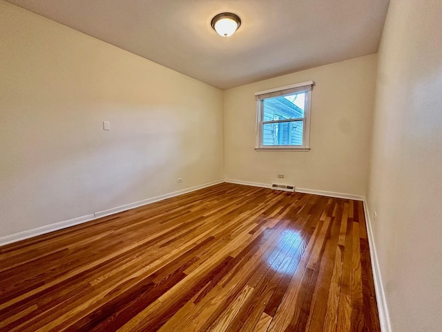 319 Triggs Ave, Elgin, IL 60123 - unfurnished room featuring dark wood-type flooring and baseboards