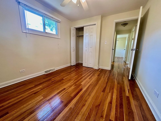 319 Triggs Ave, Elgin, IL 60123 - unfurnished bedroom featuring dark wood-type flooring, a closet, and ceiling fan