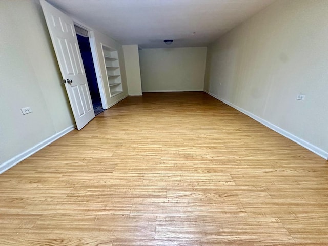 319 Triggs Ave, Elgin, IL 60123 - unfurnished room with built in shelves and light wood-type flooring
