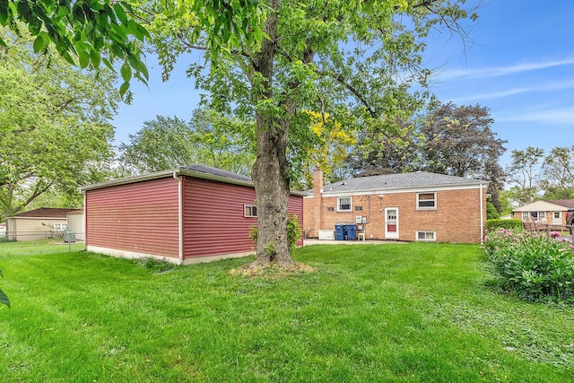 3918 213th Pl, Matteson, IL 60443 - back of house with a chimney, brick siding, and a patio