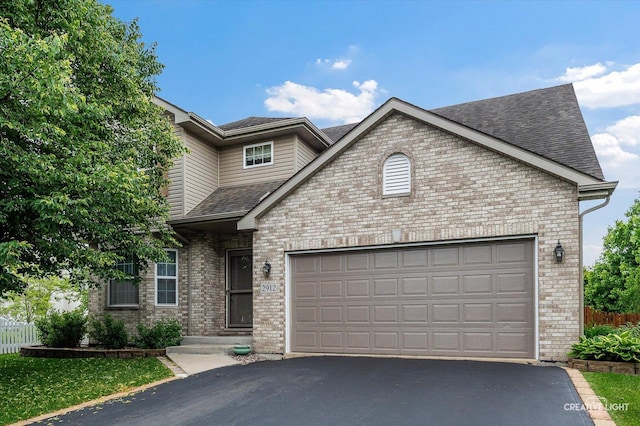 2912 Indian Springs Ct, Joliet, IL 60435 - traditional-style house with driveway, brick siding, a garage, and roof with shingles