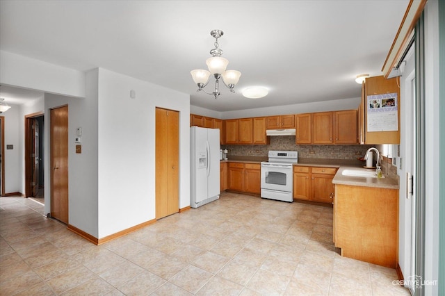 2912 Indian Springs Ct, Joliet, IL 60435 - kitchen featuring white appliances, a sink, a chandelier, light countertops, and backsplash