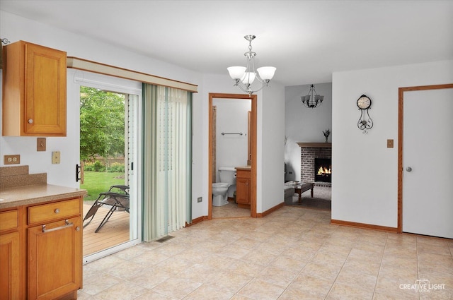 2912 Indian Springs Ct, Joliet, IL 60435 - dining space with a chandelier and a fireplace