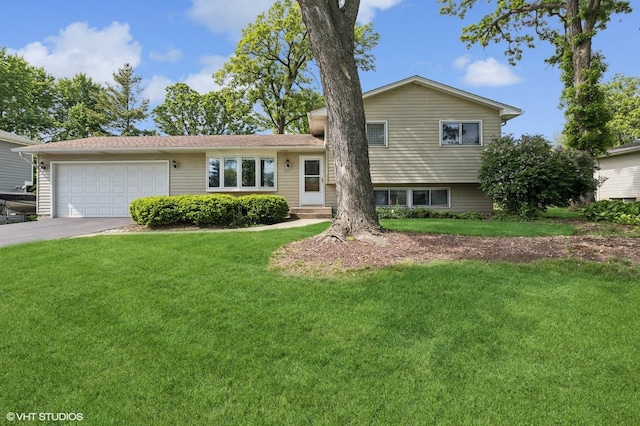 7404 Wooded Shore Dr, Wonder Lake, IL 60097 - split level home featuring an attached garage, driveway, and a front lawn