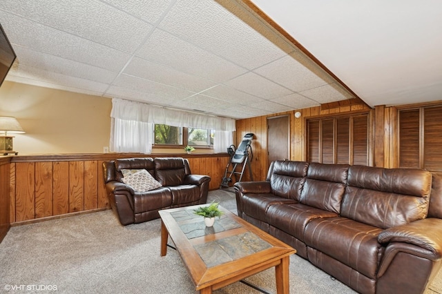 7404 Wooded Shore Dr, Wonder Lake, IL 60097 - carpeted living room with wooden walls and a drop ceiling