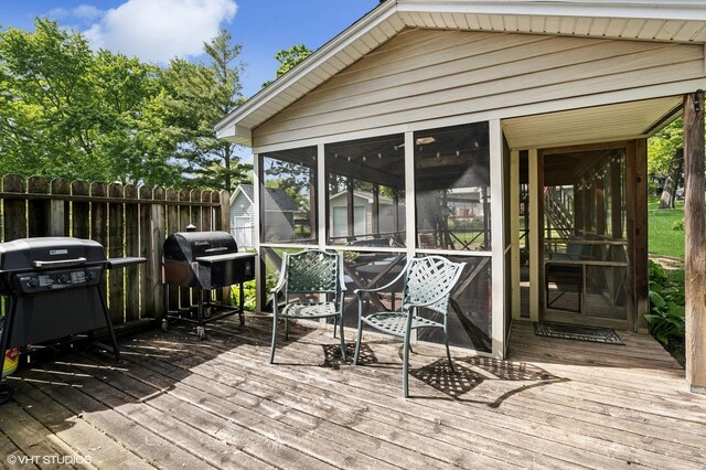 7404 Wooded Shore Dr, Wonder Lake, IL 60097 - wooden deck with a sunroom and a grill