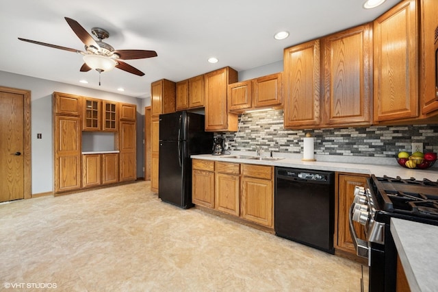 7404 Wooded Shore Dr, Wonder Lake, IL 60097 - kitchen featuring black appliances, a ceiling fan, brown cabinets, recessed lighting, and light countertops