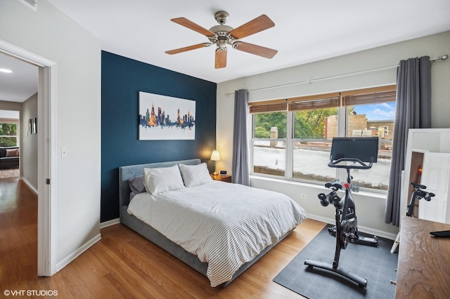 6250 N Magnolia Ave Unit 3, Chicago, IL 60660 - bedroom featuring wood finished floors, multiple windows, and baseboards